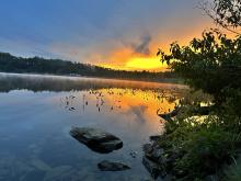Image of sunrise over a Maine pond